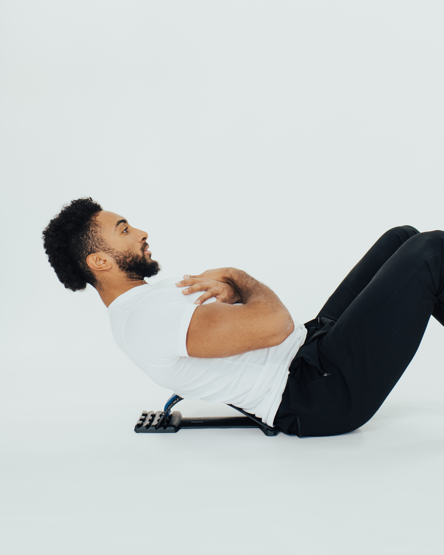 Man using the iGel Back Stretcher on the floor